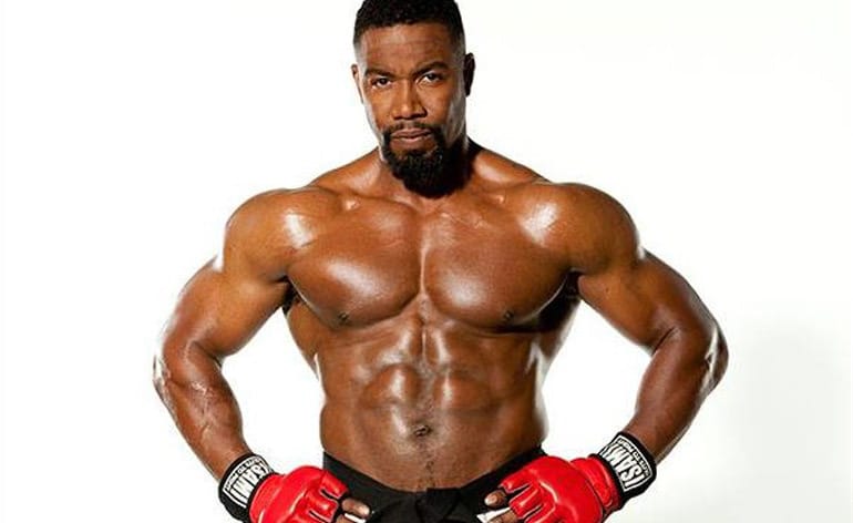 "Michael Jai White martial arts master showcasing combat techniques from his multiple martial arts styles including Shotokan and Kyokushin Karate"